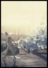 Photograph of woman in gray dress with blue balloons on street-6