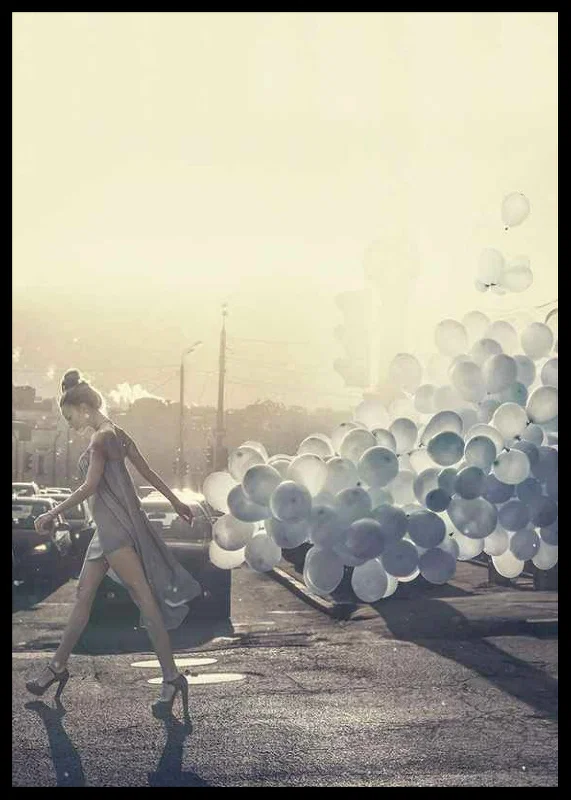 Photograph of woman in gray dress with blue balloons on street-12