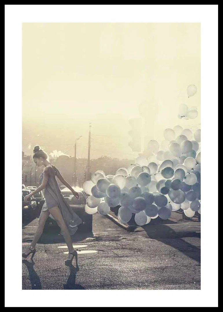Photograph of woman in gray dress with blue balloons on street-12