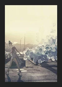 Photograph of woman in gray dress with blue balloons on street-5