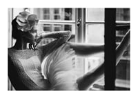 Black and white photograph of woman in lace dress by window-1