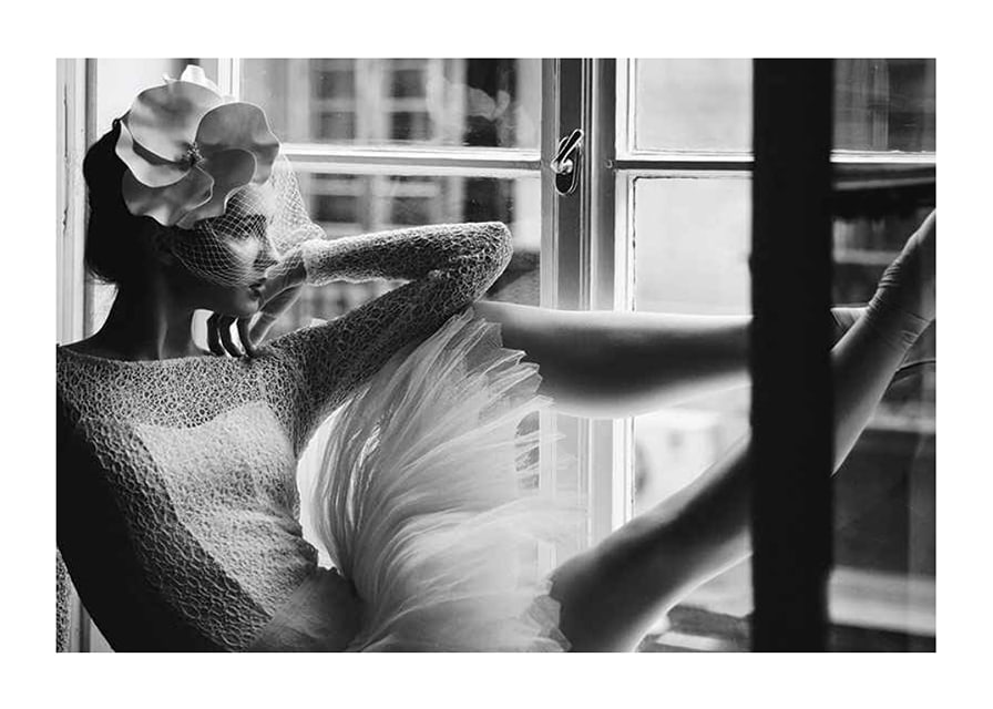 Black and white photograph of woman in lace dress by window-12