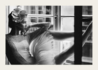 Black and white photograph of woman in lace dress by window-3