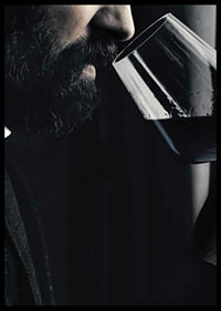 Close-up of man with beard smelling red wine in glass-6