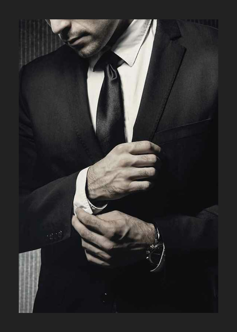 Close-up of man in black suit adjusting cufflinks-12