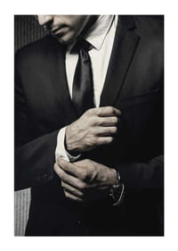 Close-up of man in black suit adjusting cufflinks-3