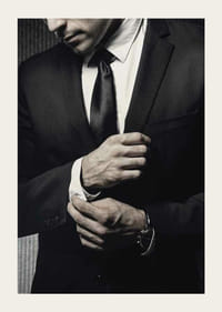 Close-up of man in black suit adjusting cufflinks-5