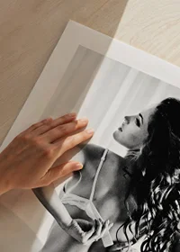 Black and white photograph of woman in lingerie on bed-9