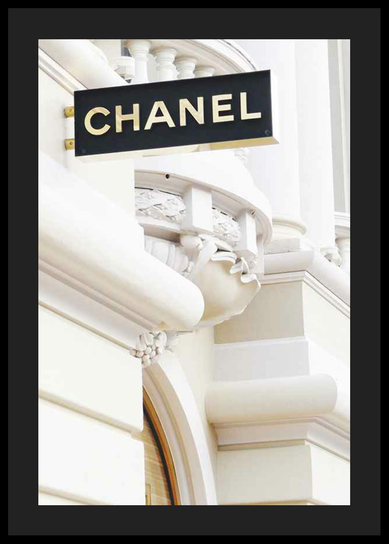 Photograph of Chanel sign against bright classic facade-12
