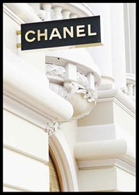 Photograph of Chanel sign against bright classic facade-6