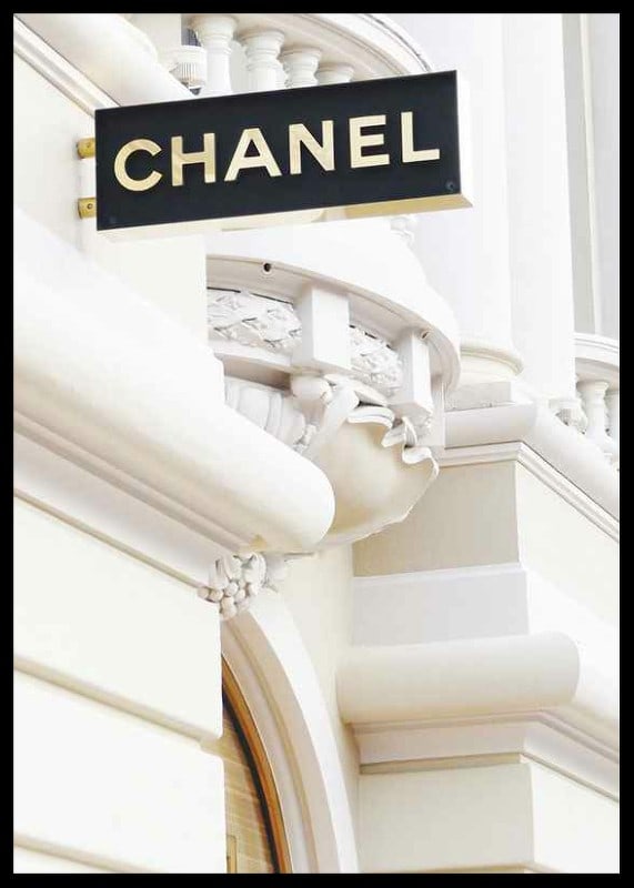 Photograph of Chanel sign against bright classic facade-12