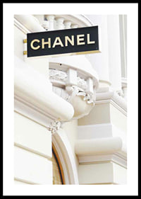 Photograph of Chanel sign against bright classic facade-0