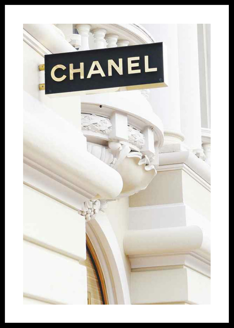 Photograph of Chanel sign against bright classic facade-12