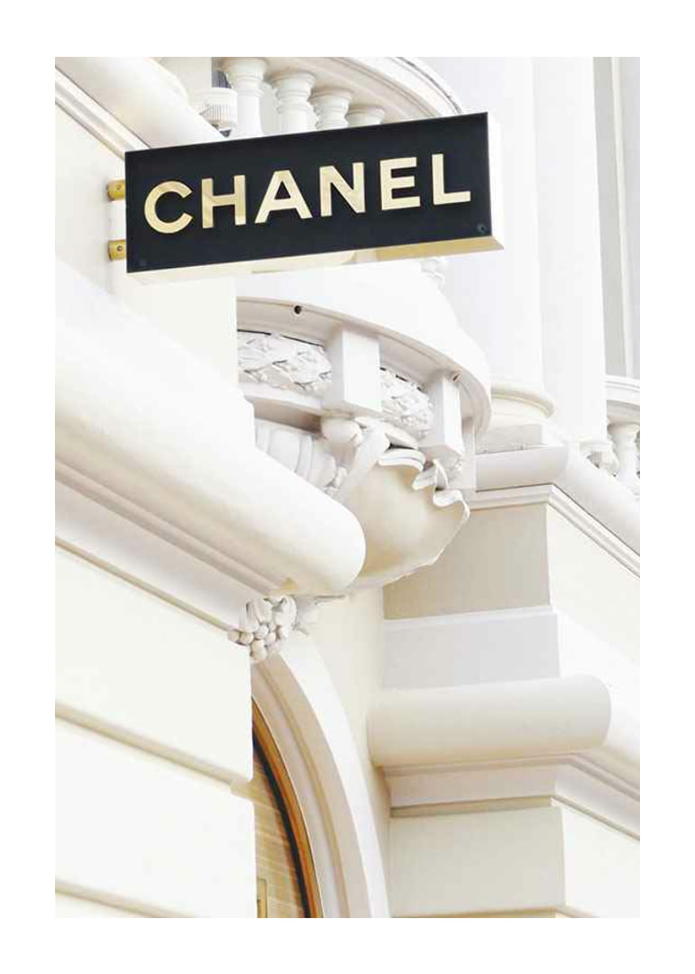 Photograph of Chanel sign against bright classic facade-12