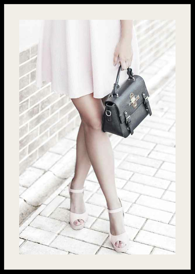 Photograph of woman in pink dress with black handbag-12