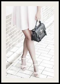 Photograph of woman in pink dress with black handbag-2