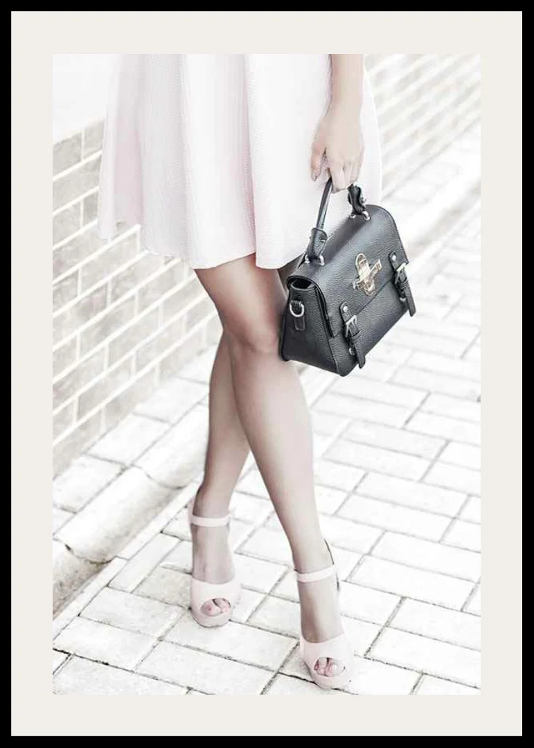 Photograph of woman in pink dress with black handbag-12