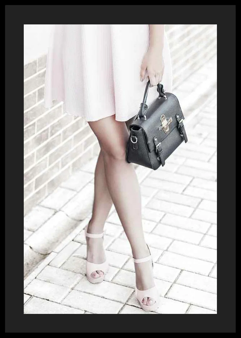 Photograph of woman in pink dress with black handbag-12