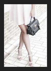Photograph of woman in pink dress with black handbag-5