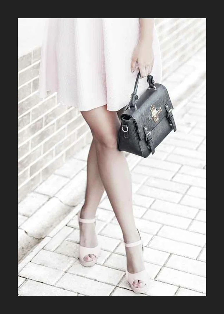 Photograph of woman in pink dress with black handbag-12