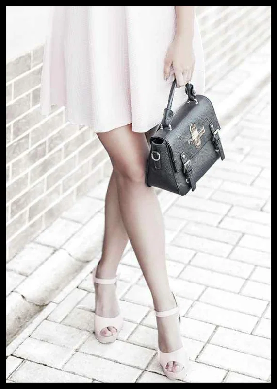 Photograph of woman in pink dress with black handbag-12
