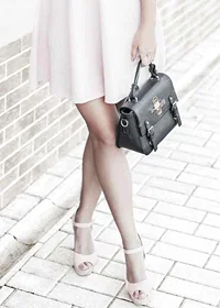 Photograph of woman in pink dress with black handbag-7
