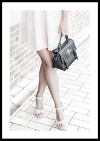 Photograph of woman in pink dress with black handbag-0