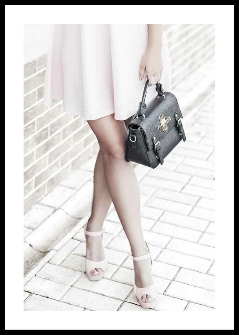 Photograph of woman in pink dress with black handbag-12