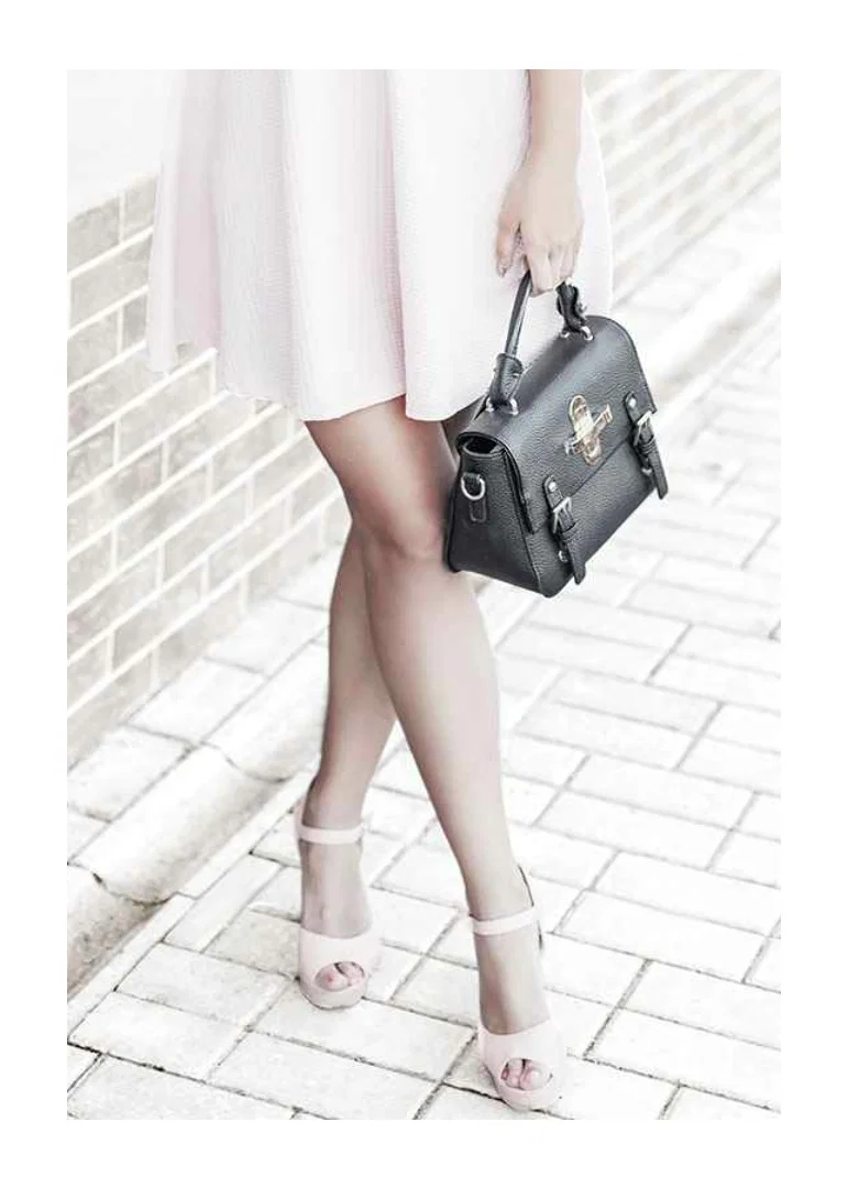 Photograph of woman in pink dress with black handbag-12