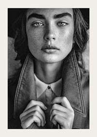 Black and white photograph of young woman with freckles and defined eyebrows-3