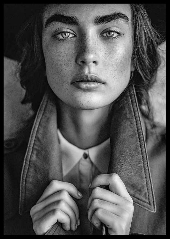 Black and white photograph of young woman with freckles and defined eyebrows-12