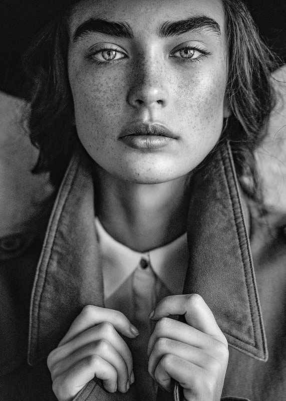Black and white photograph of young woman with freckles and defined eyebrows-12