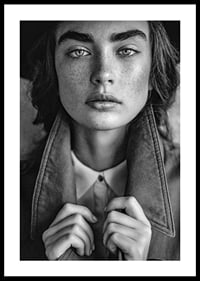 Black and white photograph of young woman with freckles and defined eyebrows-0