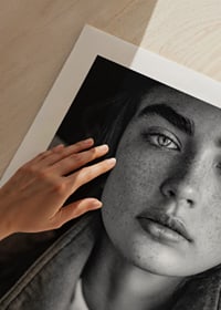 Black and white photograph of young woman with freckles and defined eyebrows-9