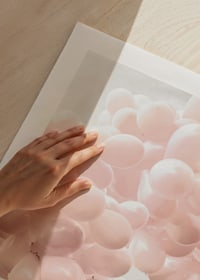 Photographic light pink balloons at rocky beach and sea-9