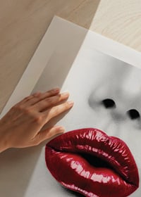 Close-up of red glossy lips on black and white face-9