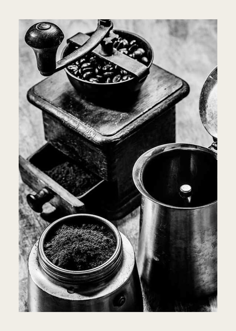 Black and white photo of old coffee grinder and coffee beans-12