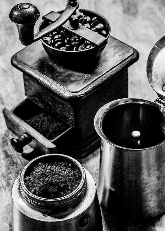 Black and white photo of old coffee grinder and coffee beans-12