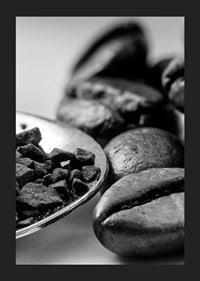 Black and white close-up of coffee beans and coffee powder on spoon-5