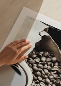 Photographic close-up of coffee cup and coffee beans in warm tones-9
