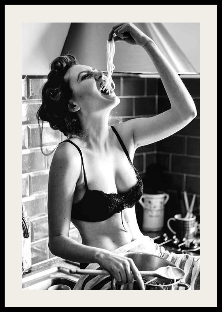 Black and white photo art with woman eating spaghetti in kitchen-12