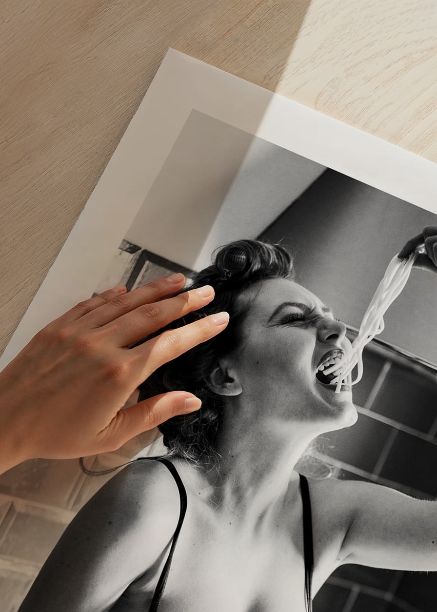 Black and white photo art with woman eating spaghetti in kitchen-12