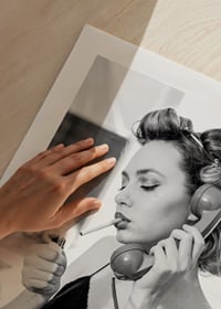 Black and white photo of woman with hair curlers, phone and cigarette-9