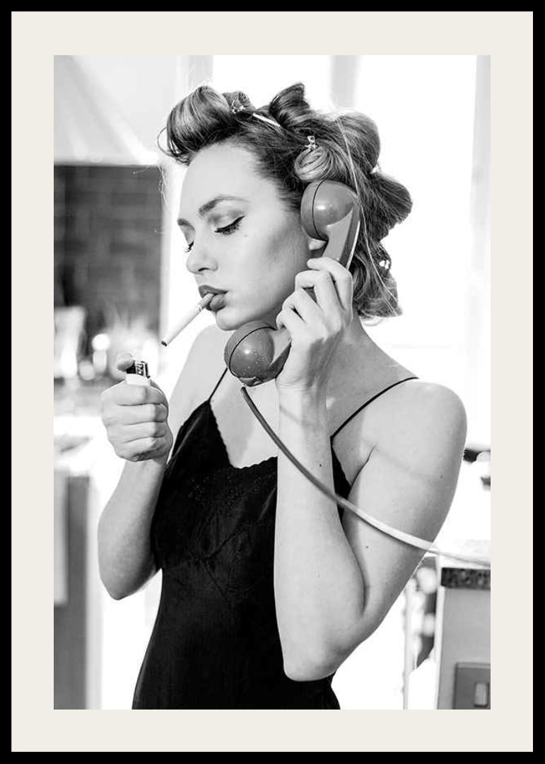 Black and white photo of woman with hair curlers, phone and cigarette-12