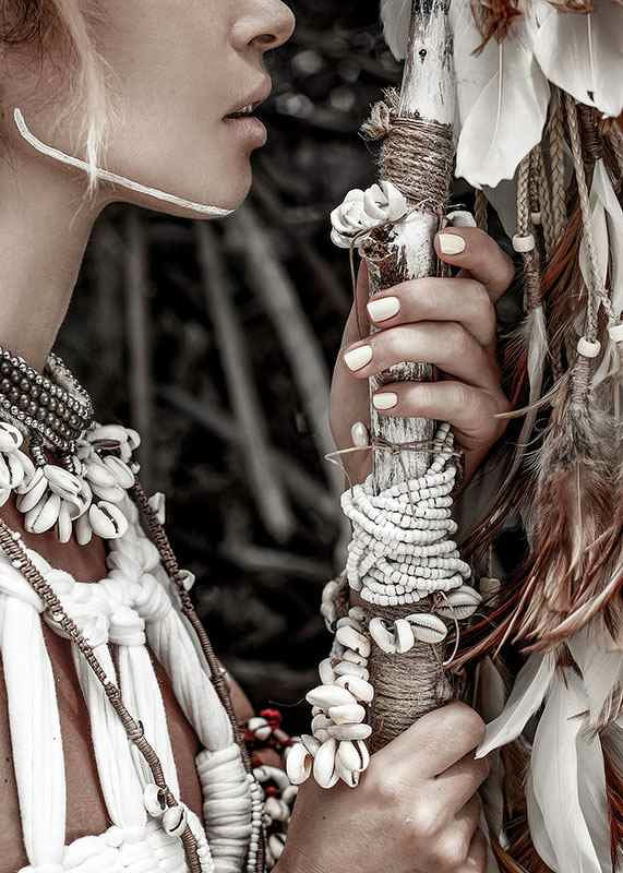 Close-up of woman with jewelry and shells in natural tones-12