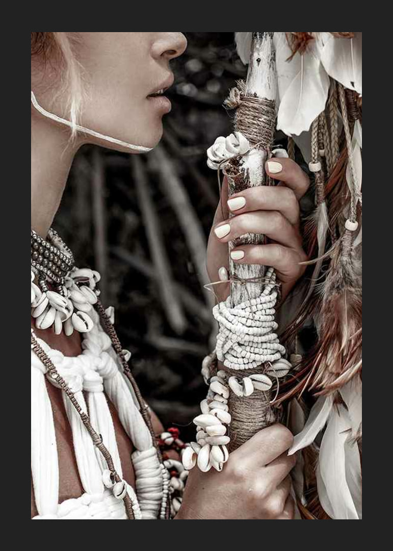 Close-up of woman with jewelry and shells in natural tones-12
