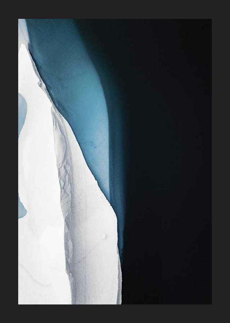 Photographic view from above of ice formation at dark water-12