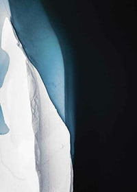 Photographic view from above of ice formation at dark water-7