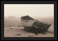 Photograph of old wooden boat on rocky beach in fog-4
