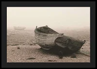 Photograph of old wooden boat on rocky beach in fog-4